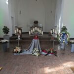 a room with flowers and candles